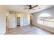 Spacious bedroom with large windows, a ceiling fan, and closet storage at 4151 E Clovis Ave, Mesa, AZ 85206
