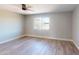 Bright bedroom with a ceiling fan, wood-look floors, and ample natural light at 4151 E Clovis Ave, Mesa, AZ 85206