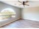 Bedroom featuring a modern ceiling fan and large, arched window at 4151 E Clovis Ave, Mesa, AZ 85206