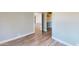 Bright bedroom showcasing hardwood floors and an open closet space at 4151 E Clovis Ave, Mesa, AZ 85206