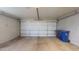 Garage showcases concrete flooring and is equipped with trash and recycling bins at 4151 E Clovis Ave, Mesa, AZ 85206