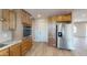 Modern kitchen featuring stainless steel appliances, wood cabinets, and wood-look flooring at 4151 E Clovis Ave, Mesa, AZ 85206