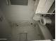 Bathroom featuring marble tile and modern white vanity at 4219 E Whitney Ln, Phoenix, AZ 85032