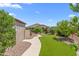 Serene backyard features a walkway through lush landscaping, creating a peaceful retreat at 4239 E Azalea Dr, Gilbert, AZ 85298