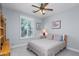 Comfortable bedroom with large window and fan at 4239 E Azalea Dr, Gilbert, AZ 85298