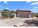 Charming single-story home with a red tile roof, desert landscaping, and a two-car garage at 4239 E Azalea Dr, Gilbert, AZ 85298
