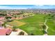 Scenic aerial view highlighting the community golf course, lush greenery, and serene landscape at 4239 E Azalea Dr, Gilbert, AZ 85298