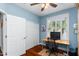 Bright home office with a large window, hardwood floors, and a ceiling fan at 4239 E Azalea Dr, Gilbert, AZ 85298