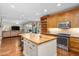Bright, open kitchen and living space with an island, wood floors and stainless steel appliances at 4239 E Azalea Dr, Gilbert, AZ 85298