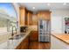 Open kitchen featuring stainless steel appliances, granite countertops, tile backsplash and a large window at 4239 E Azalea Dr, Gilbert, AZ 85298