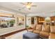 Bright living room with natural light, hardwood floors, and a view of the patio and kitchen at 4239 E Azalea Dr, Gilbert, AZ 85298
