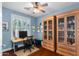 Home office with natural light, hardwood floors, built-in cabinets and desk at 4239 E Azalea Dr, Gilbert, AZ 85298