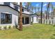 Lush backyard with palm trees, manicured lawn, and a stylish modern home at 4301 E Sells Dr, Phoenix, AZ 85018