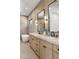 Elegant bathroom with a soaking tub, dual sinks, modern fixtures, and sleek lighting at 4301 E Sells Dr, Phoenix, AZ 85018