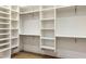 Organized walk-in closet with shelving and hanging rods, perfect for wardrobe storage at 4301 E Sells Dr, Phoenix, AZ 85018
