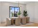 Bright dining room featuring modern decor, hardwood floors, and view to the home's exterior at 4301 E Sells Dr, Phoenix, AZ 85018