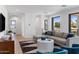 Bright living room with comfortable seating and a stylish rug, ideal for relaxing at 4301 E Sells Dr, Phoenix, AZ 85018