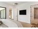 Spacious main bedroom with a view and a wall-mounted television for relaxing evenings at 4301 E Sells Dr, Phoenix, AZ 85018