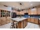 Spacious kitchen featuring stainless steel appliances, a tile backsplash, and an island at 4437 E Dartmouth St, Mesa, AZ 85205