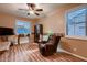 The cozy sitting room features a comfortable recliner and natural lighting at 4437 E Dartmouth St, Mesa, AZ 85205