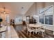 Open concept living space with vaulted ceilings, wood floors, and large windows at 4437 E Dartmouth St, Mesa, AZ 85205