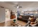 Open-concept living room shows the kitchen, lots of light, and warm earth tones at 4437 E Dartmouth St, Mesa, AZ 85205