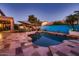 Beautiful backyard pool with a spacious patio, complete with outdoor furniture and a barbecue area at 4437 E Dartmouth St, Mesa, AZ 85205