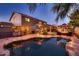 A backyard pool with patio, grill, and gazebo; perfect for entertaining and relaxing at 4437 E Dartmouth St, Mesa, AZ 85205