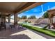 Outdoor patio with a swimming pool, fire pit, and comfortable seating for backyard entertaining at 4667 E Reins Rd, Gilbert, AZ 85297