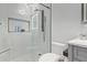 Contemporary bathroom with a glass shower, tiled floors, and marble countertop at 4667 E Reins Rd, Gilbert, AZ 85297