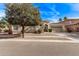 Inviting single-story home with low maintenance desert landscaping, archway gate and a two-car garage at 4667 E Reins Rd, Gilbert, AZ 85297