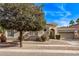 Charming single-story home boasts a meticulously landscaped yard and attached two-car garage at 4667 E Reins Rd, Gilbert, AZ 85297