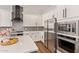 Elegant kitchen with stainless steel appliances, white cabinets, and granite countertops at 4667 E Reins Rd, Gilbert, AZ 85297