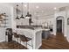 Stylish kitchen with white cabinets, stainless steel appliances, and a breakfast bar at 4667 E Reins Rd, Gilbert, AZ 85297