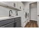 Laundry room with gray cabinets, white countertop, sink, and appliances at 4667 E Reins Rd, Gilbert, AZ 85297