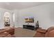 Cozy living room showcasing seamless access to dining area and an eye-catching tv feature at 4667 E Reins Rd, Gilbert, AZ 85297