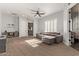 Large living room with a ceiling fan, and a sectional sofa, offering a comfortable and versatile living space at 4667 E Reins Rd, Gilbert, AZ 85297