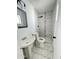 Modern bathroom featuring a new walk-in shower with marble tiling and stylish vanity at 4916 W Earll Dr, Phoenix, AZ 85031