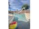 Backyard pool with a slide and clear blue water offers a fun outdoor experience at 4916 W Earll Dr, Phoenix, AZ 85031