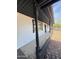 Covered porch with stone columns and patterned tile flooring, perfect for outdoor enjoyment at 4916 W Earll Dr, Phoenix, AZ 85031
