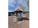 Decorative well in the front yard adds a charming and unique touch to the property at 4916 W Earll Dr, Phoenix, AZ 85031