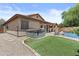 Private backyard features a hot tub, patio, pool, and artificial grass at 5303 W Hackamore Dr, Phoenix, AZ 85083