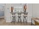 Kitchen bar with seating for three and stylish pendant lighting at 5303 W Hackamore Dr, Phoenix, AZ 85083