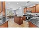 Modern kitchen featuring stainless steel appliances and dark wood cabinetry at 5303 W Hackamore Dr, Phoenix, AZ 85083