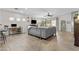 Spacious living room with tile flooring, ceiling fan, and sliding glass doors at 5303 W Hackamore Dr, Phoenix, AZ 85083