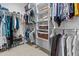 Well-organized walk-in closet with multiple hanging rods, shelves, and shoe racks at 5303 W Hackamore Dr, Phoenix, AZ 85083