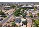 High aerial of the home with its dark roof nestled in a well-established neighborhood at 5808 W Myrtle Ave, Glendale, AZ 85301