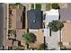 An aerial view reveals the home's layout, the green back yard, and its place among neighboring houses at 5808 W Myrtle Ave, Glendale, AZ 85301
