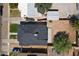 An aerial shot shows the home's dark roof, yard, and surrounding neighborhood layout at 5808 W Myrtle Ave, Glendale, AZ 85301