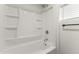 Clean and bright bathroom with a white tub and shower combination and chrome fixtures at 5808 W Myrtle Ave, Glendale, AZ 85301